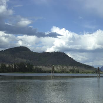 Sandy mountains with trees and lake