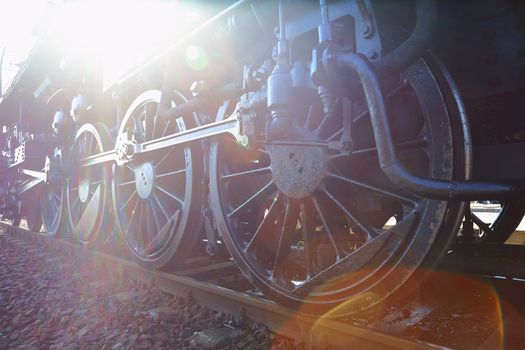 Steam locomotive with flaring sunlight