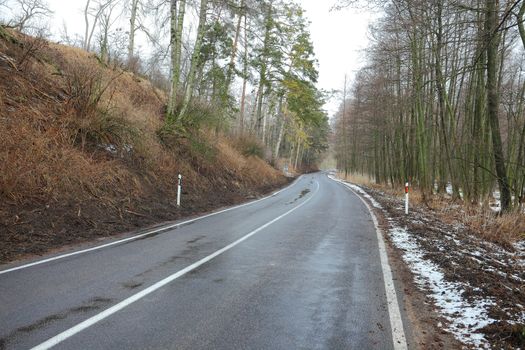 Wet road in cold autumn