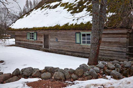 Old woode house in snow