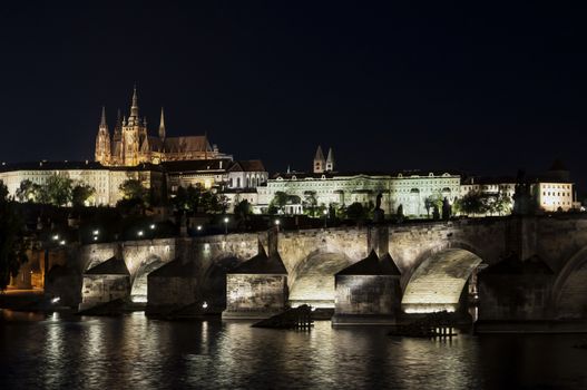 St. Vitus Cathedral and Charles bridge at night, Prague, Czech Republic. Oil paint effect.