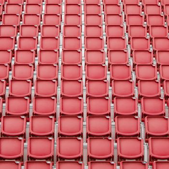 Red seat in sport stadium, empty seats ready for the public