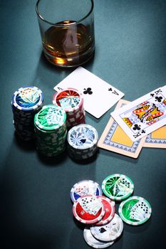 Playing poker concept. Stack of chips and playing cards