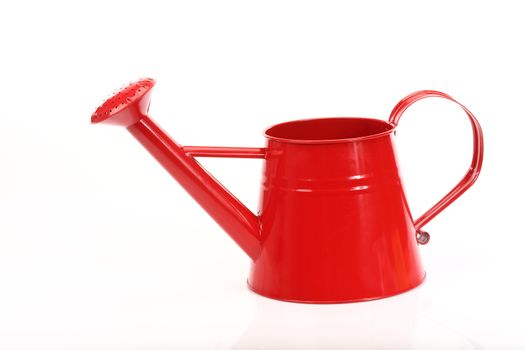 red watering can on white  background