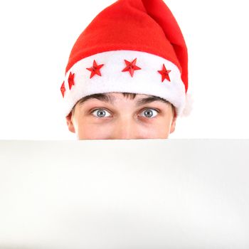 Surprised Teenager in Santa's Hat behind Empty White Board