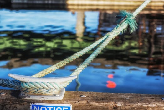 ship line to dock anchor, water in background