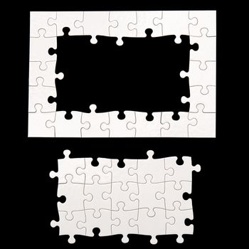 White puzzle on a black background