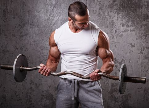 Fitness. Handsome man during workout