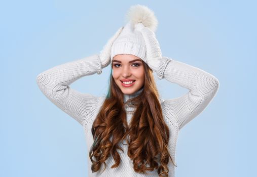 Winter. Cute girl on a blue background
