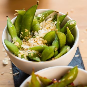 Green string beans chinese dish with spices. Selective focus