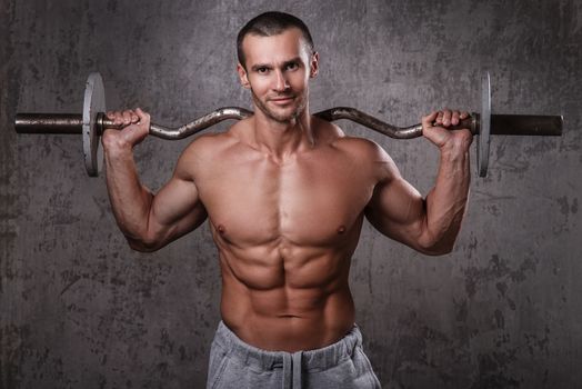 Fitness. Handsome man during workout