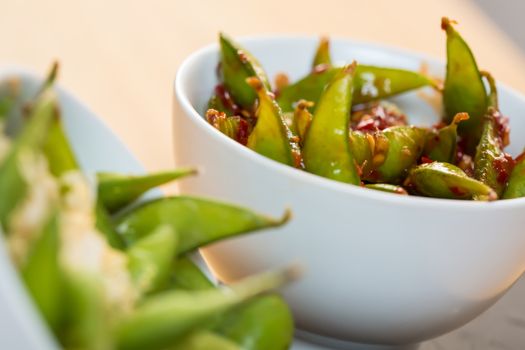 Green string beans chinese dish with spices. Selective focus