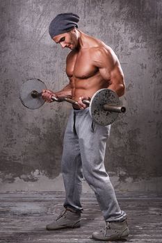 Fitness. Handsome man during workout