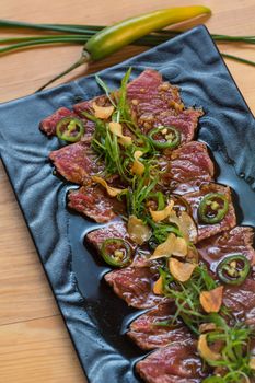 Beef Carpaccio on dark background. selective focus