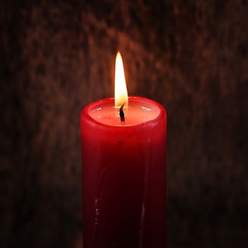 Red candle on the table