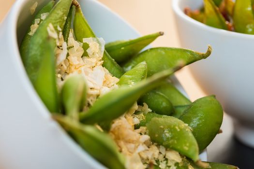 Green string beans chinese dish with spices. Selective focus