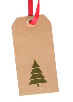 Blank christmas gift tag with tree symbol over a white background