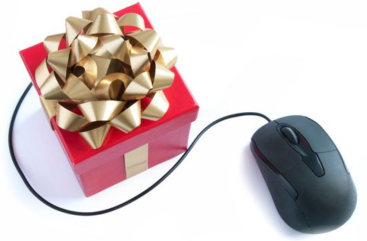 Computer mouse and christmas gift box with golden ribbon bow 