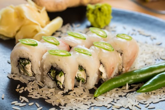 set of Japanese sushi on a black plate