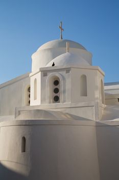The white church on the top of Chora at the Naxos island at the Cyclades of the Aegean sea in Greece