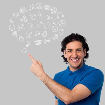 Smiling man showing set of business icons