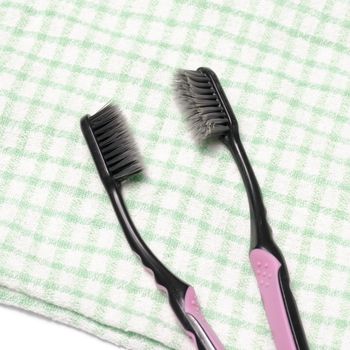 tooth brush and towel on a white background