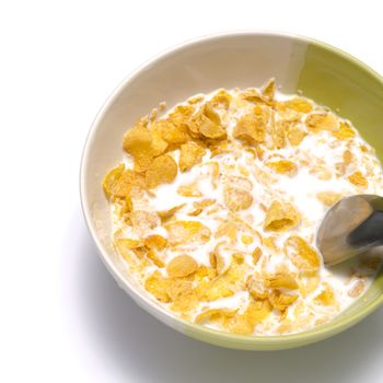 corn flakes in bowl on a white background