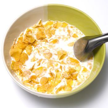 corn flakes in bowl on a white background