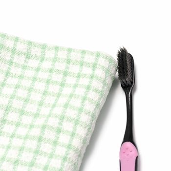 tooth brush and towel on a white background