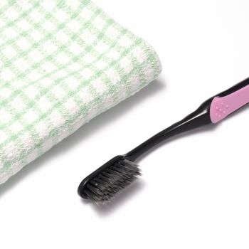 tooth brush and towel on a white background