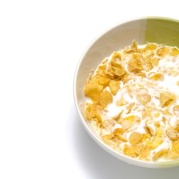 corn flakes in bowl on a white background