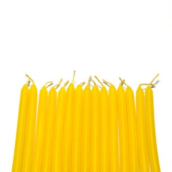 yellow candle on a white background