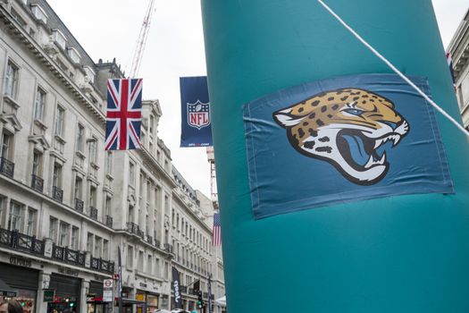 LONDON, UK - SEPTEMBER 27: Jacksonville Jaguars banner and NFL flags above in Regent Street. September 27, 2014 in London. The street was closed to traffic to host NFL related games and events.