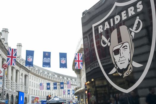 LONDON, UK - SEPTEMBER 27: Detail of Oklahoma Raiders banner and NFL flags above in Regent Street. September 27, 2014 in London. The street was closed to traffic to host NFL related games and events.