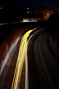 Traffic at night with traces of car lights