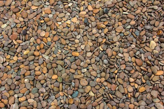 Pile of round peeble stones for background