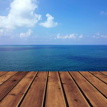Ocean with sky and wood floor for background