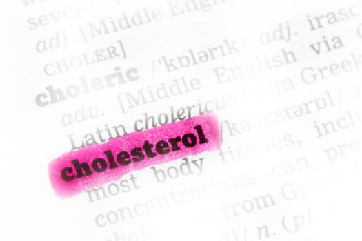 Cholesterol  highlighted in dictionary with pen closeup