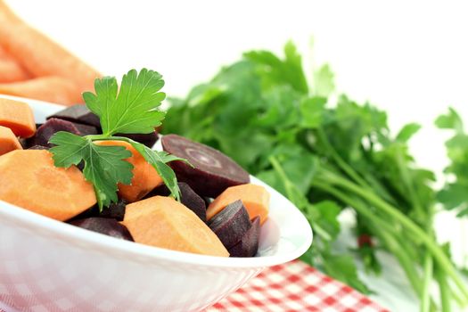 crisp orange and purple carrots on a light background