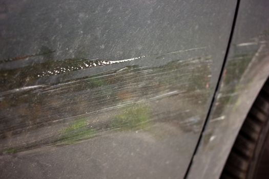 Car door with scratches after accident
