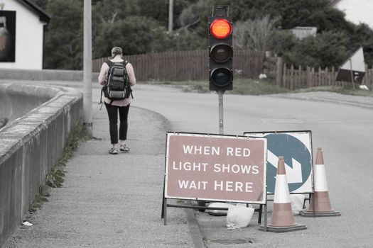 Emergency traffic light with sign at a road in Scotland