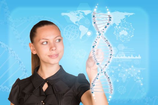 Beautiful businesswoman in dress smiling and presses finger on model of DNA. Scientific and medical concept