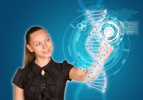 Beautiful businesswoman in dress smiling and presses finger on model of DNA. Scientific and medical concept