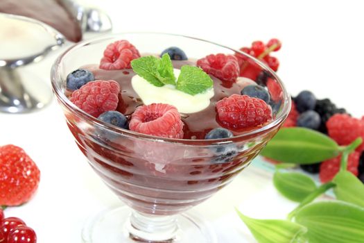 red fruit jelly with custard on a light background