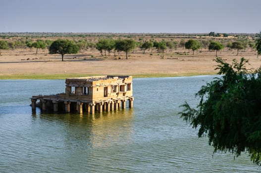 Ancient hindu stone temple in the middle of Gadisar lake, Jaisalmer, Rajasthan
