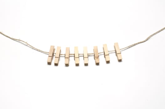 cloth pin hang with rope on a white background