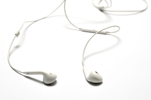white earphones on a white background