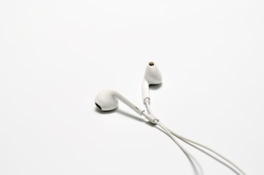 white earphones on a white background
