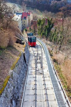 Graz, Austria - January 16, 2011:  Modern funicular climbing to Schlossberg and Graz city panoramic view, Austria