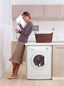 pretty smiling woman in the laundry room 